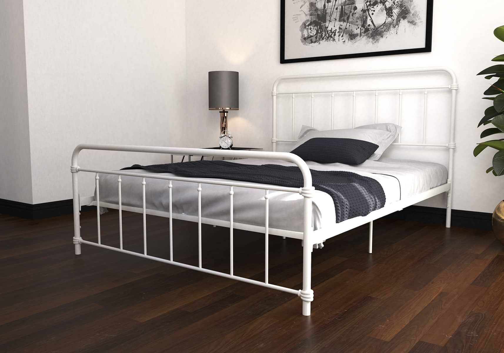 White metal double bed with grey and white bedsheets