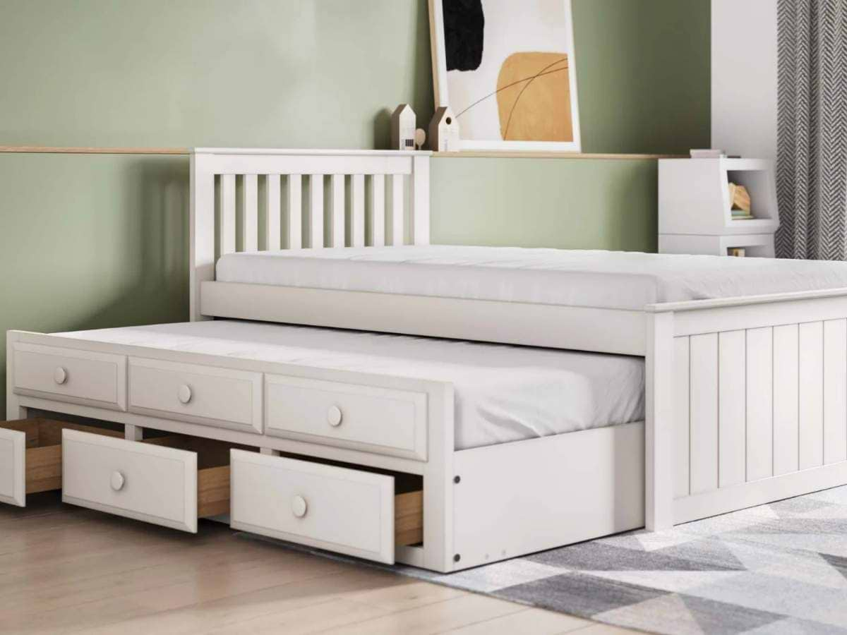 White storage bed with pull-out guest bed and storage drawers underneath