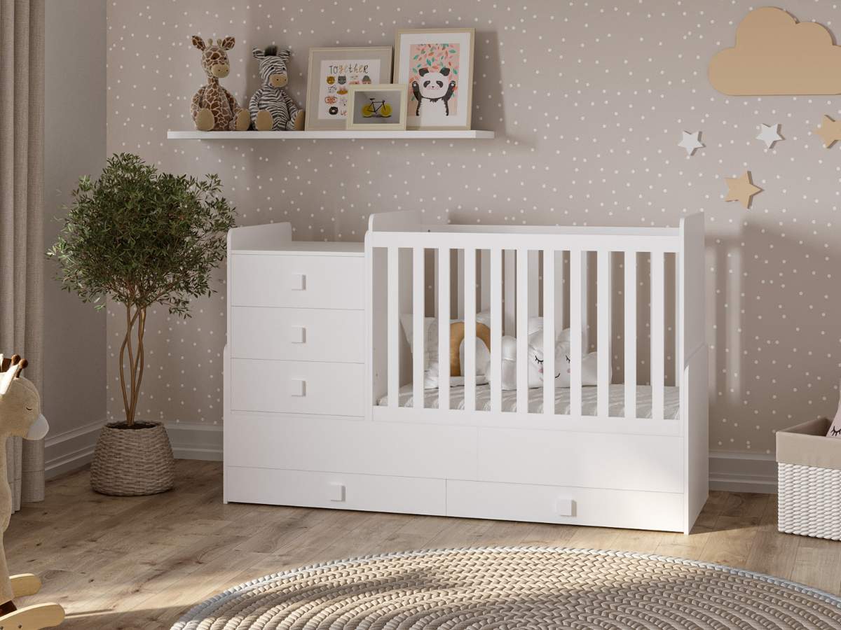 white cot with attached drawers