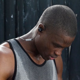 man wearing Sweatproof Earbuds
