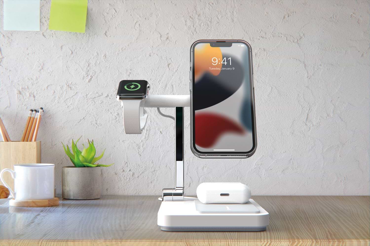 iphone, AirPods and Apple watch charging on wireless portable charger sitting on desk in office