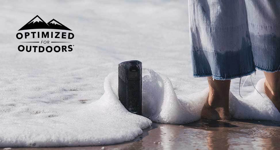 image of speaker in water and sand