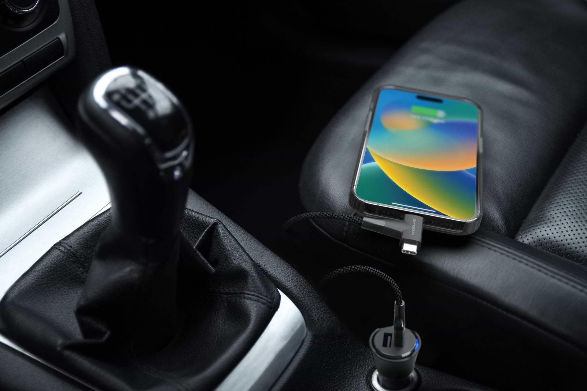 iphone on passengers seat in vehicle charging via Scosche hammer head lightning cable connected to 12V car charger