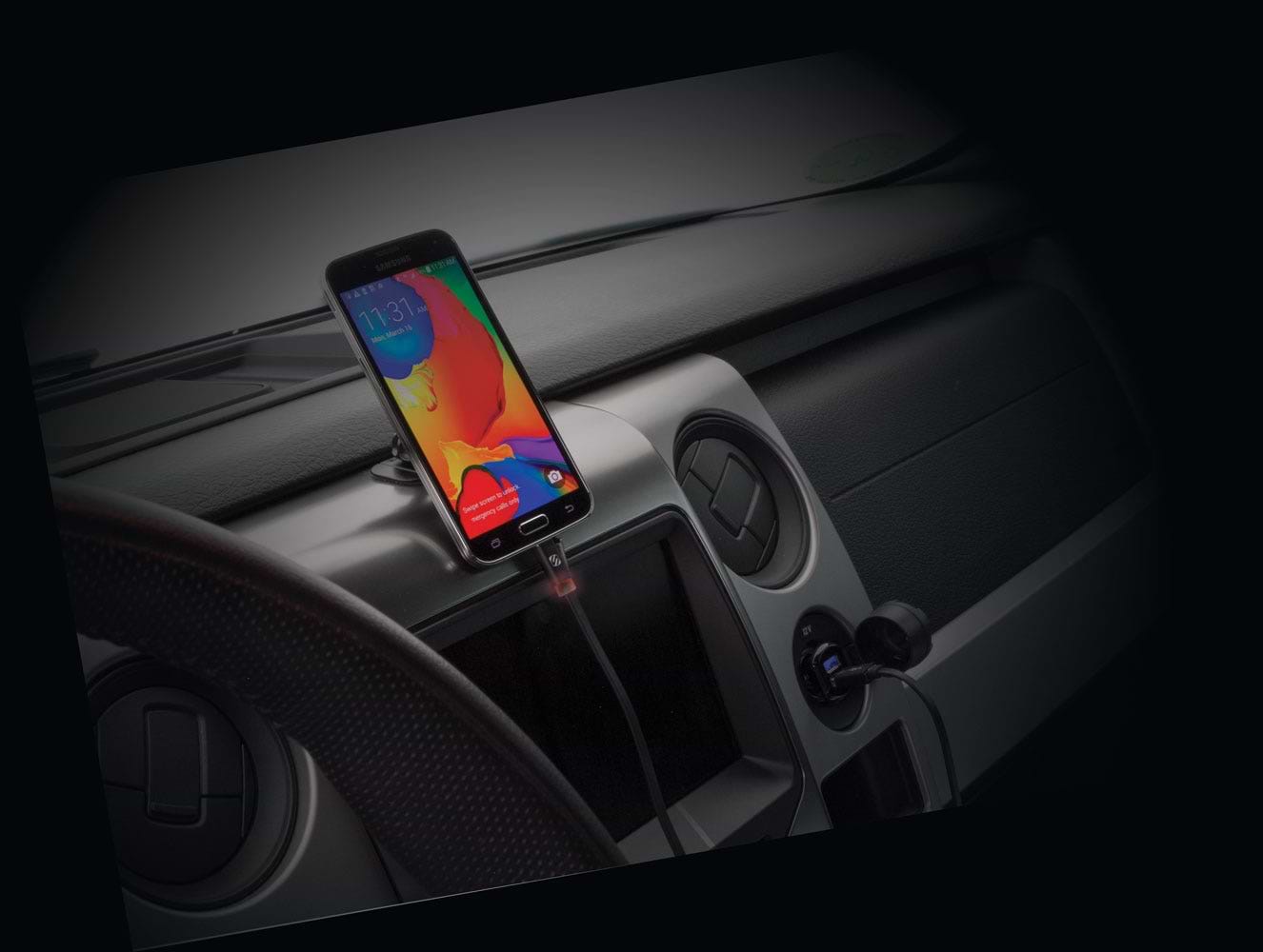 phone charging via Scosche flat USB-C cable plugged into Power Delivery cigarette lighter port with phone mounted to dash