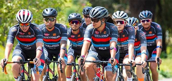 bicyclists group of bicyclists wearing heart rate monitor armbands