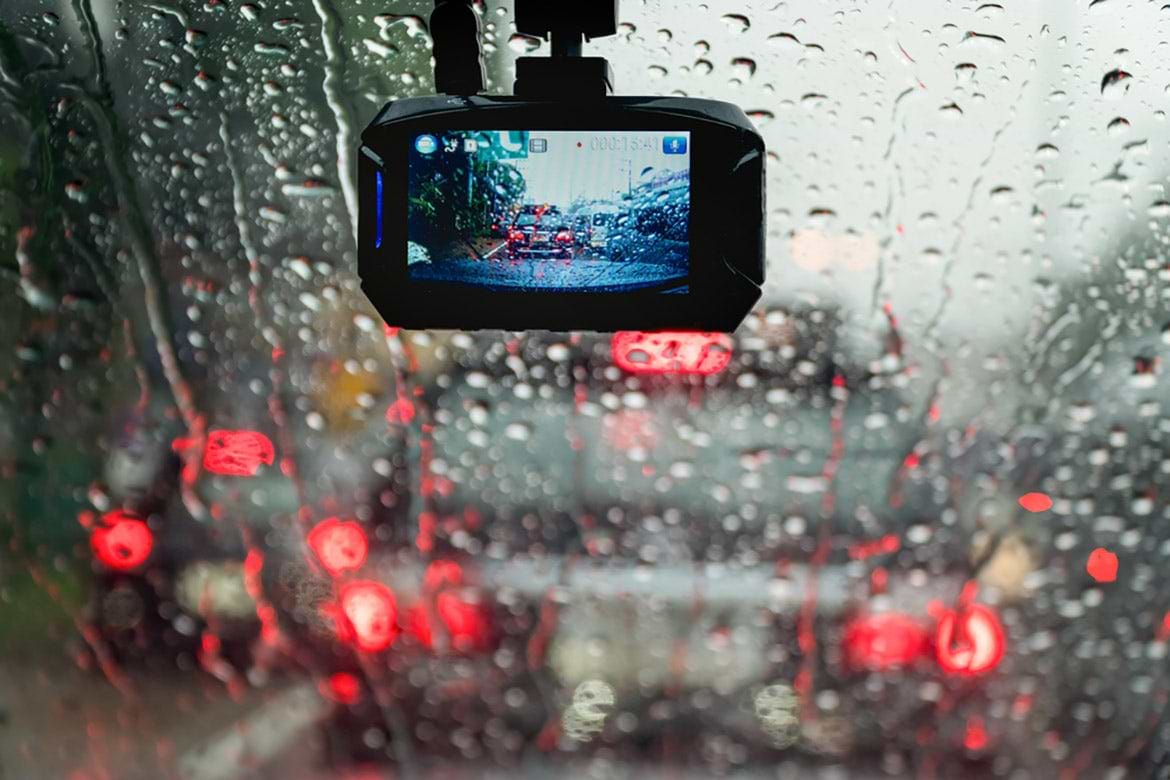 car video recorder car video recorder mounted to windshield during rain
