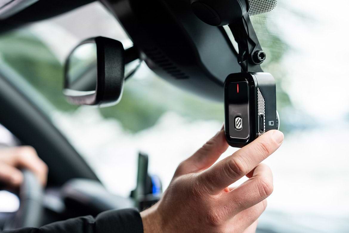 dash cam man adjusting Scosche dash cam