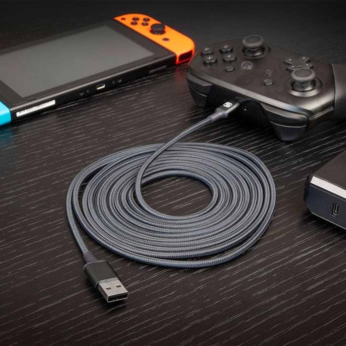 gaming cable braided cable plugged into game controller next to hand held game