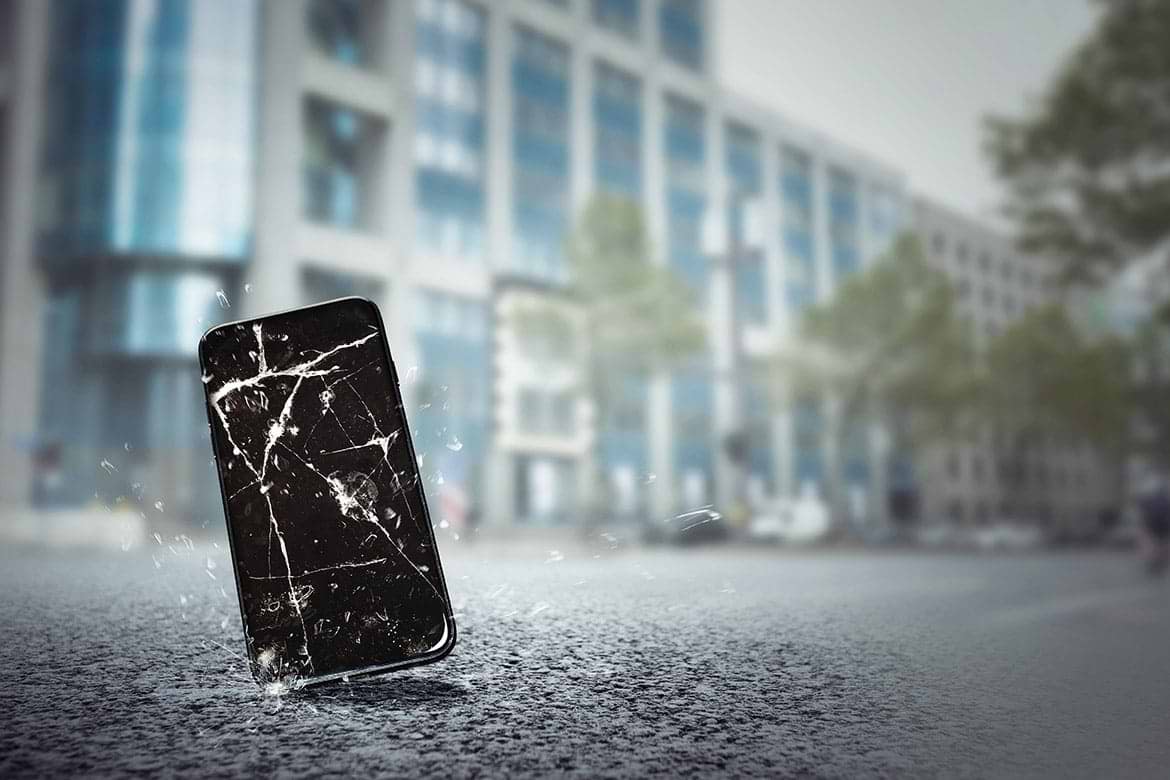 mobile phone falls on the street mobile phone falls on the street and screen is cracked