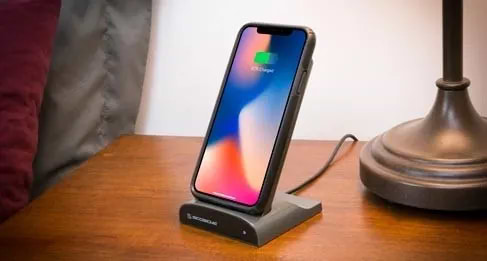 phone charging on nightstand phone charging via wireless charger on nightstand