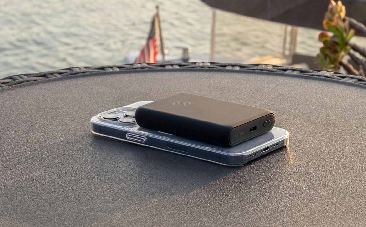 portable charger portable charging via power bank sitting on table