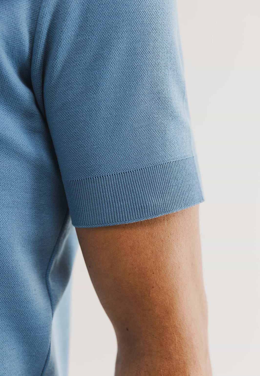 Gebreide-polo-met-rubberen-print