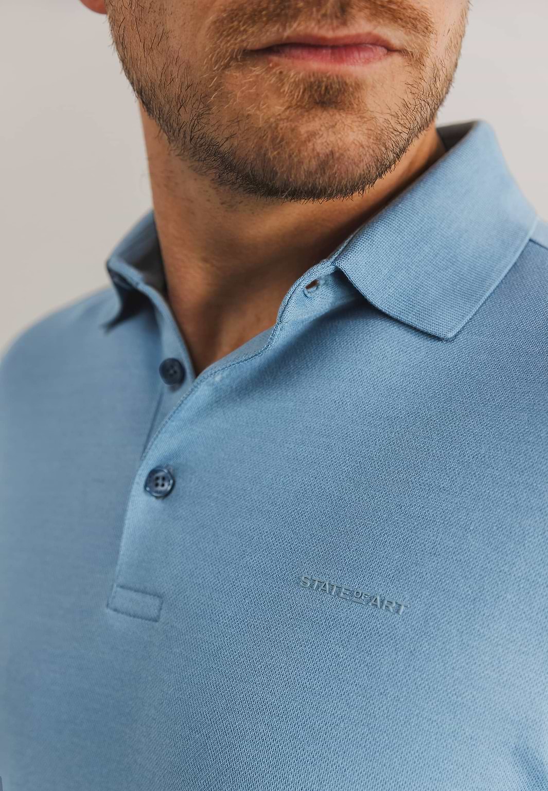Gebreide-polo-met-rubberen-print