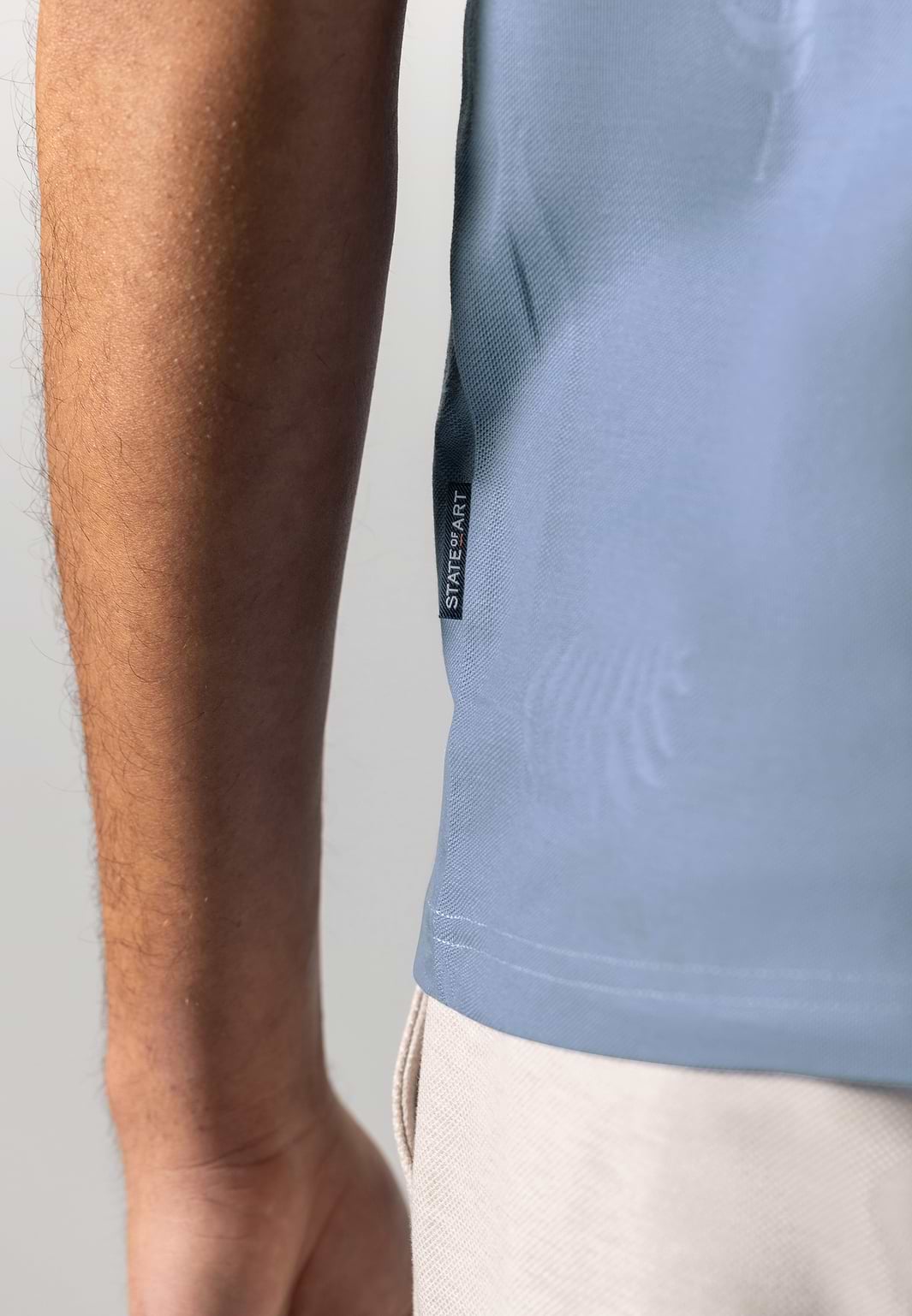 Piqué-polo-with-jacquard-leaf-pattern