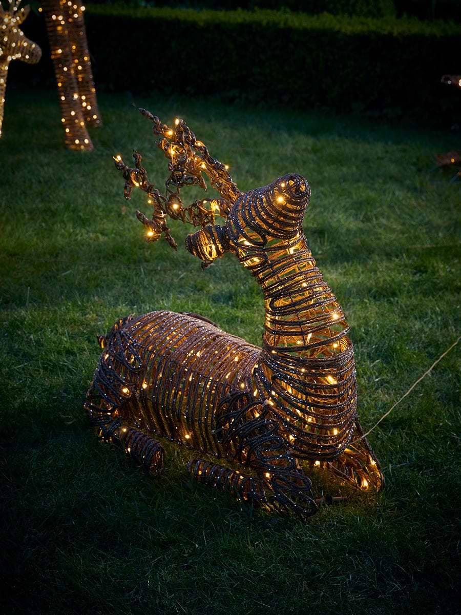 Soft Gold Faux Wicker Sit Down Lit Reindeer
