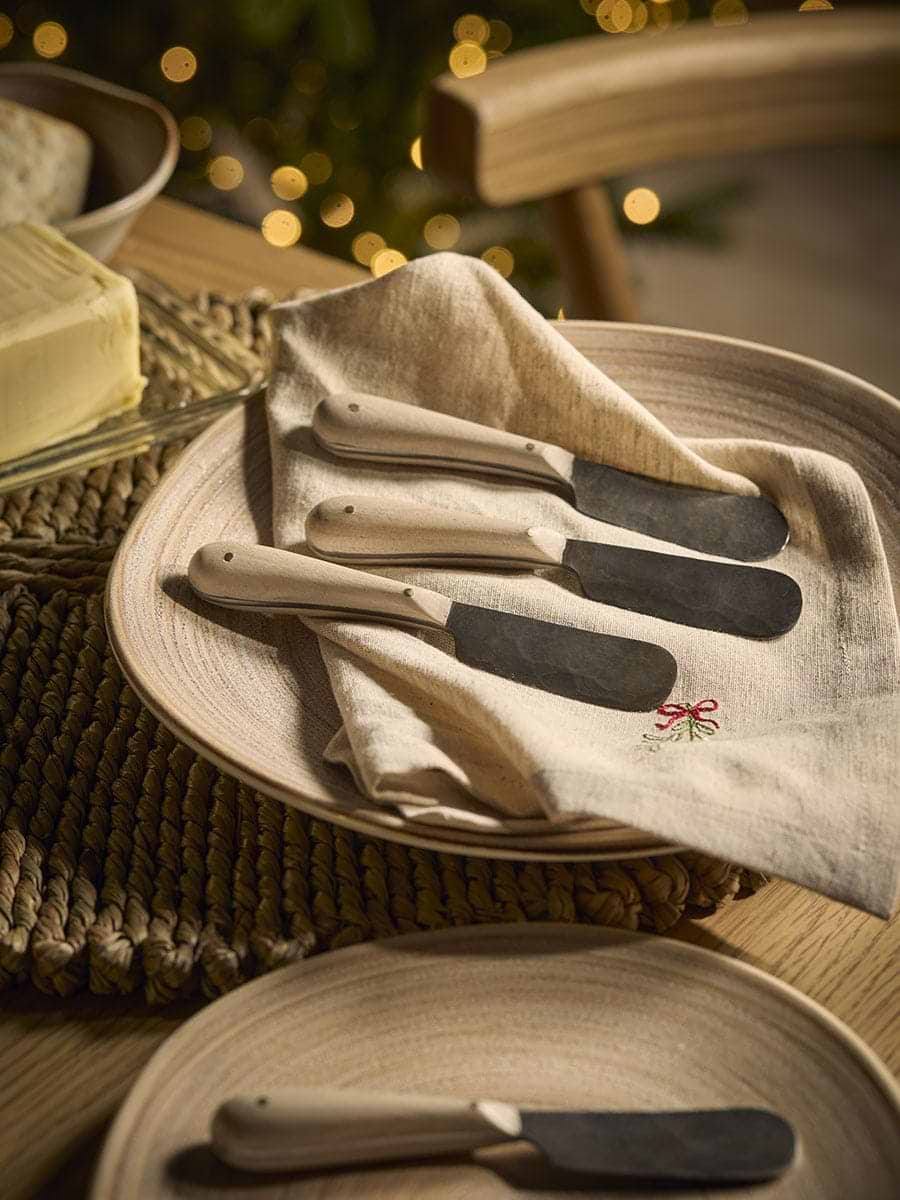 Four Oak Handle Butter Knives