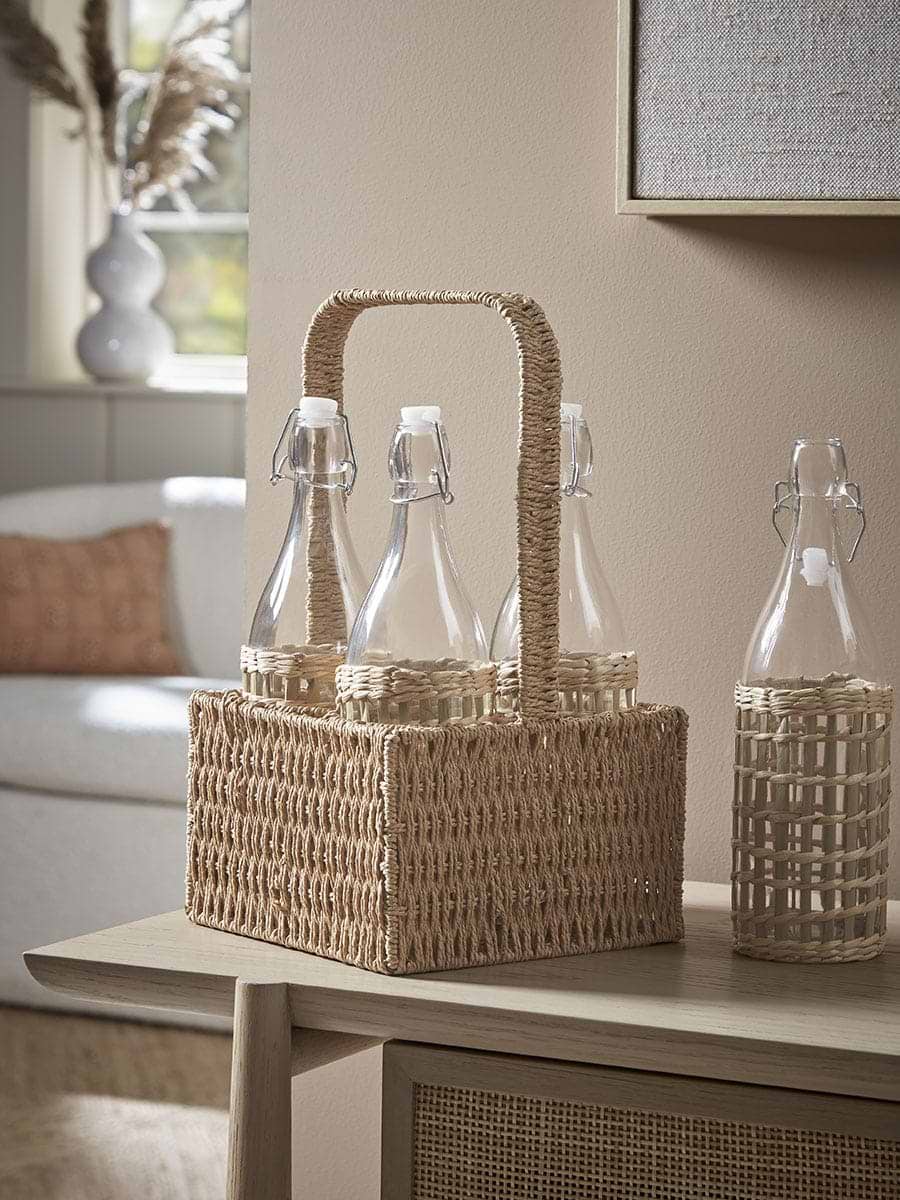 Four Glass Bottles & Wicker Holder