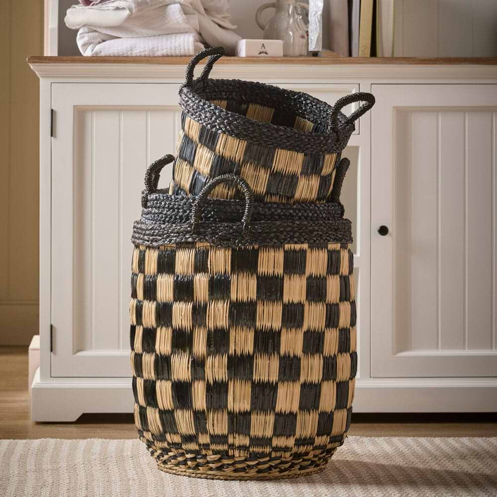 Black and natural checked storage baskets in a laundry room