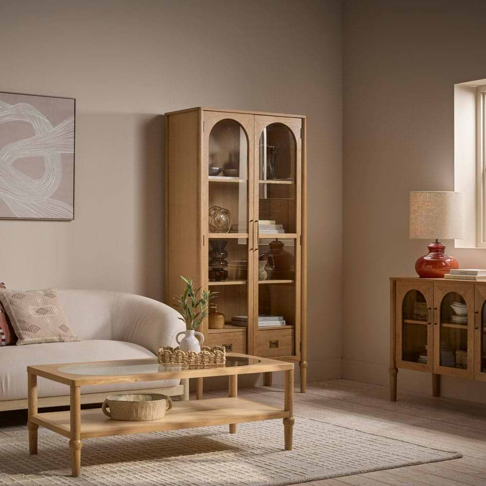 Sideboard and cabinet with arched glass doors in a scandi living room