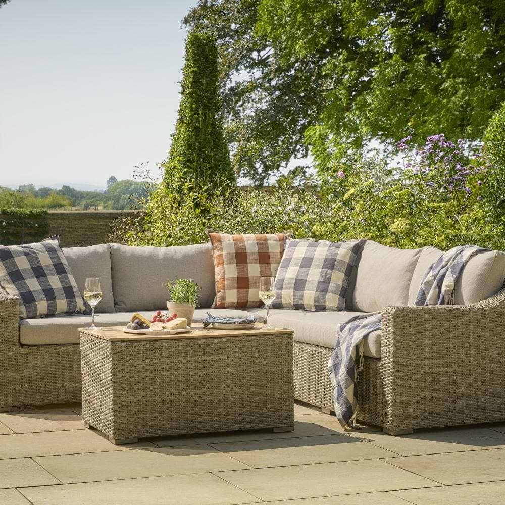 Cox & Cox garden corner sofa in pale straw rattan with checked cushions 
