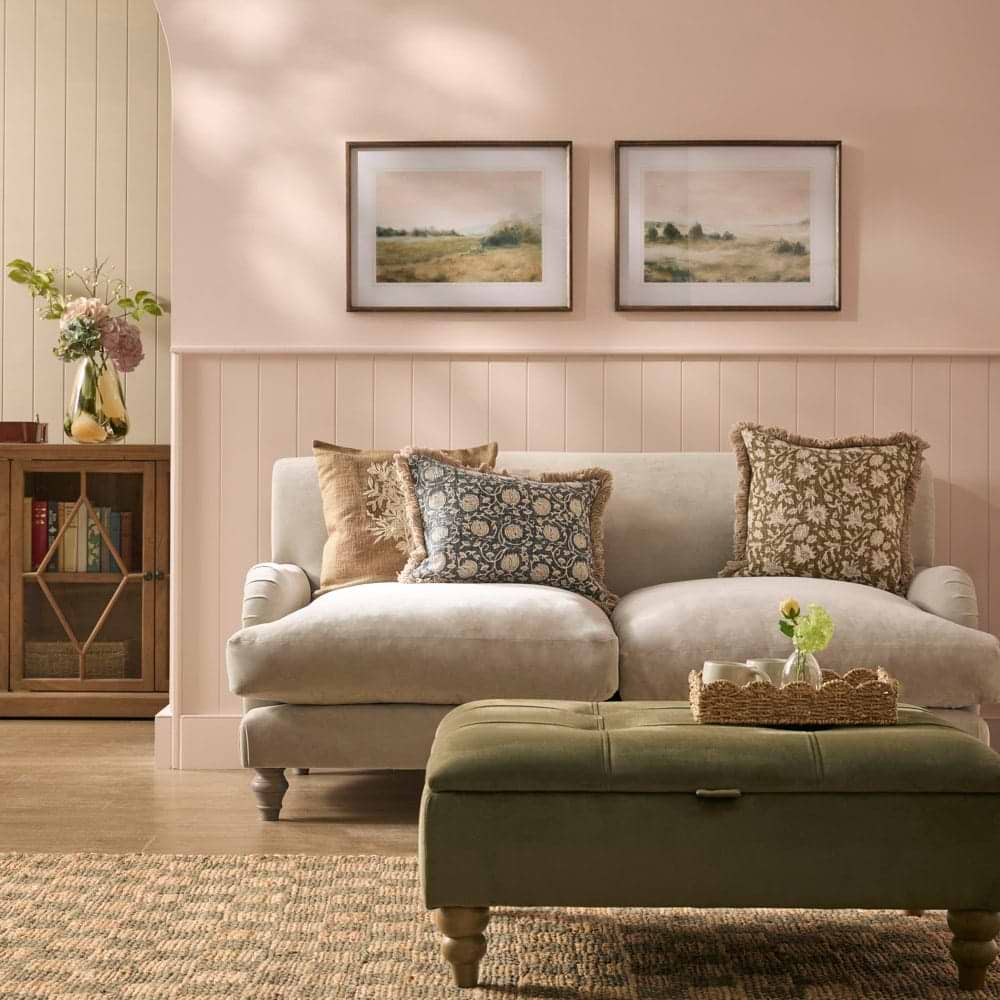 A cream sofa in a living room setting