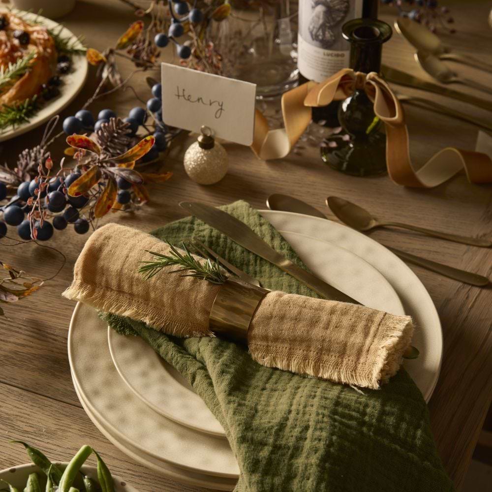 Dining table styled with napkins, placemats and accessories from the Cox & Cox dining collection.