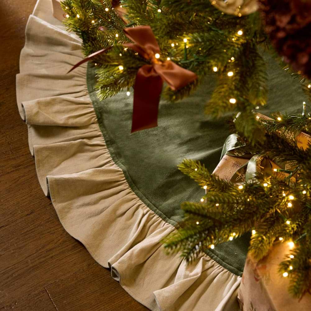 A green velvet and linen frilled Christmas tree skirt